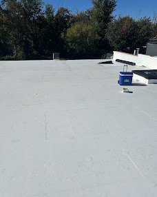 Light-colored flat-roof surface with raised roof details.