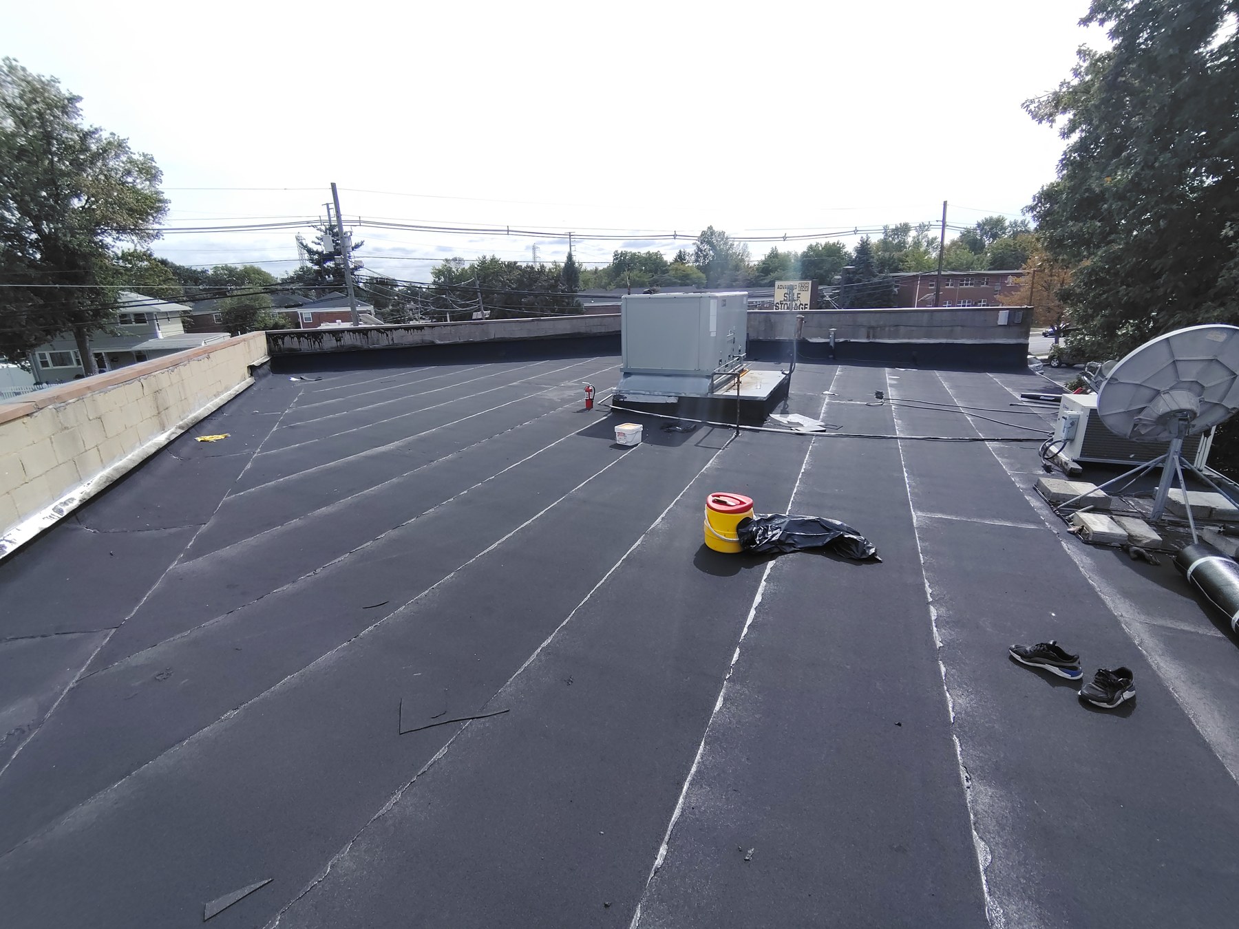 Wide view of the modified bitumen roofing project on Richmond Hill Road in Staten Island