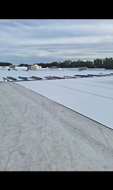 Roofing membrane installation in progress across a large roof.