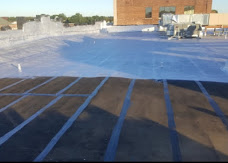 Roof surface with seams treated in a grid pattern during work.